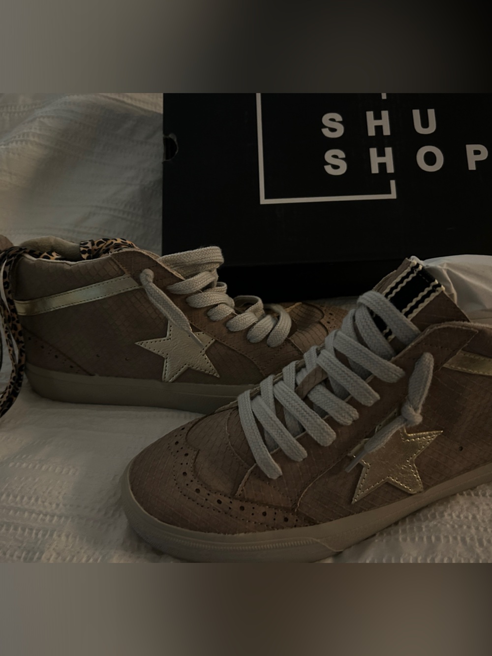 Shu Shop Star Accent High-Top Sneakers in Taupe w pair of cheetah print laces